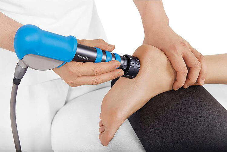 shockwave therapy being applied to foot